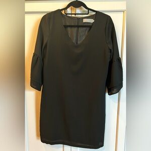 slip over your head, wear w/heels or flats. Black, mid thigh, fits size 4-6.